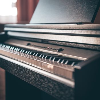 Close-up, electronic piano in a dark room.